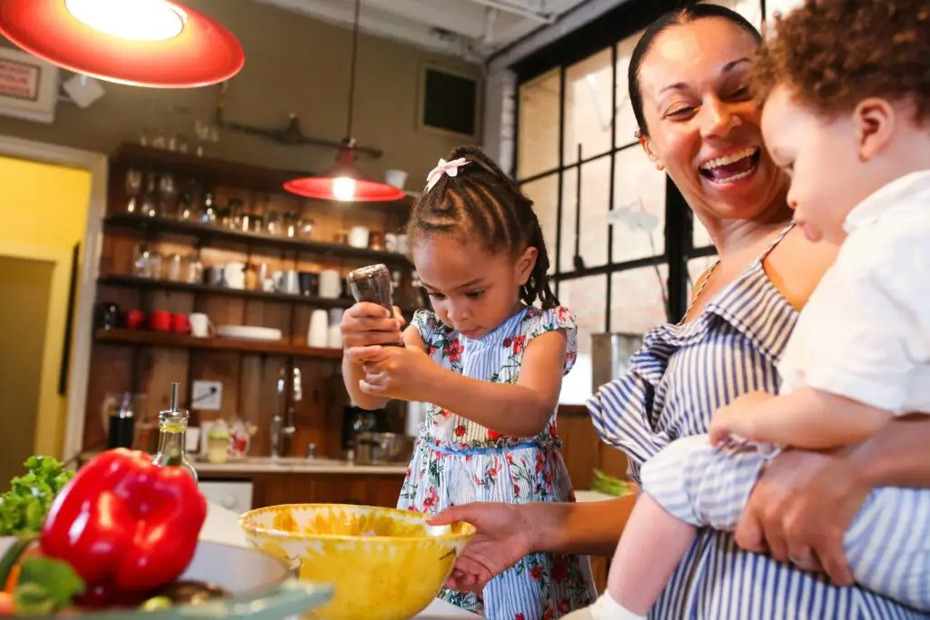 A family cooking in the kitchen following successful ARFID treatment