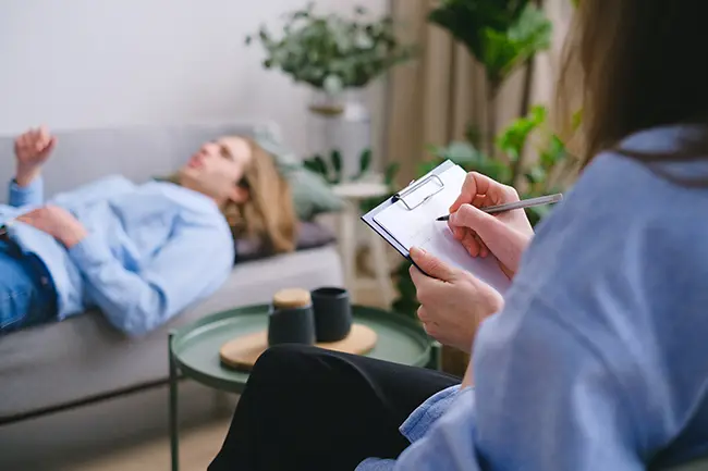 arfid treatment adults | patient on sofa in clinic